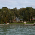Perspectives Home Designs Blue 2-story home with lakeside view